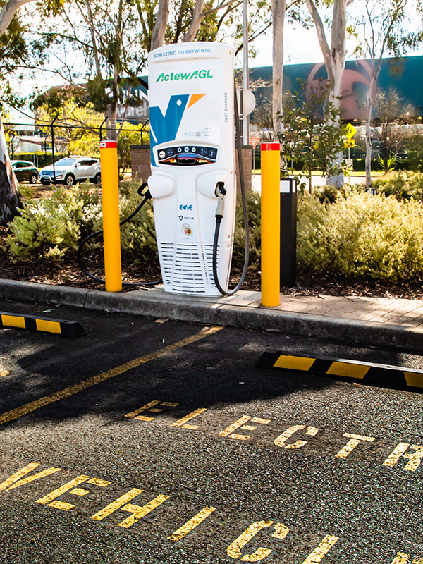 The Impact of Vehicle Electrification on Safety Header - post - Apr2025 Photo of an EV charge station