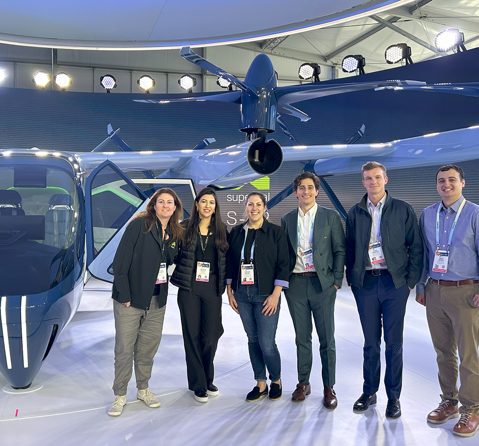 Supernal - Page - Jan2025 Staff pose next to Supernal's electric Vertical Take-Off & Landing (eVTOL)