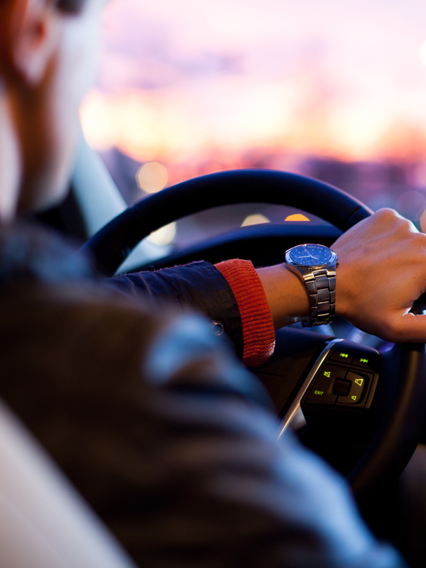 VMT Metrics Header - blog - March2025 A person driving a car through the city