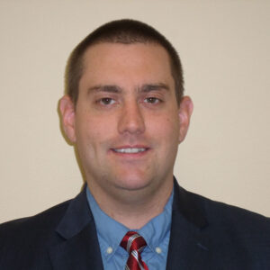 headshot of Claude Strayer