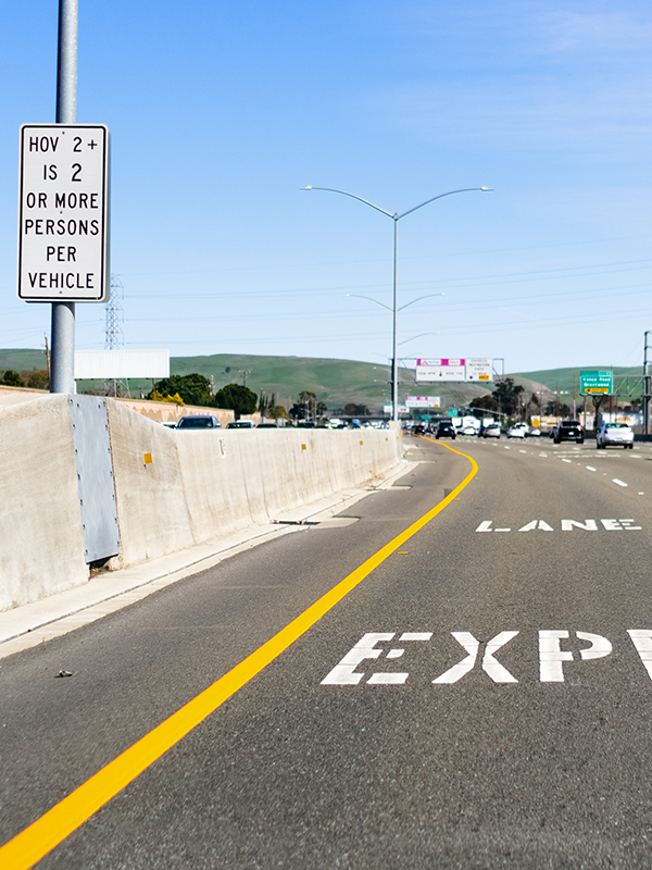 Express Lane marking on the freeway; San Francisco Bay Area, Cal Express Lane marking on the freeway; San Francisco Bay Area, California; Express lanes help manage lane capacity by allowing single occupancy vehicles to use them for a fee