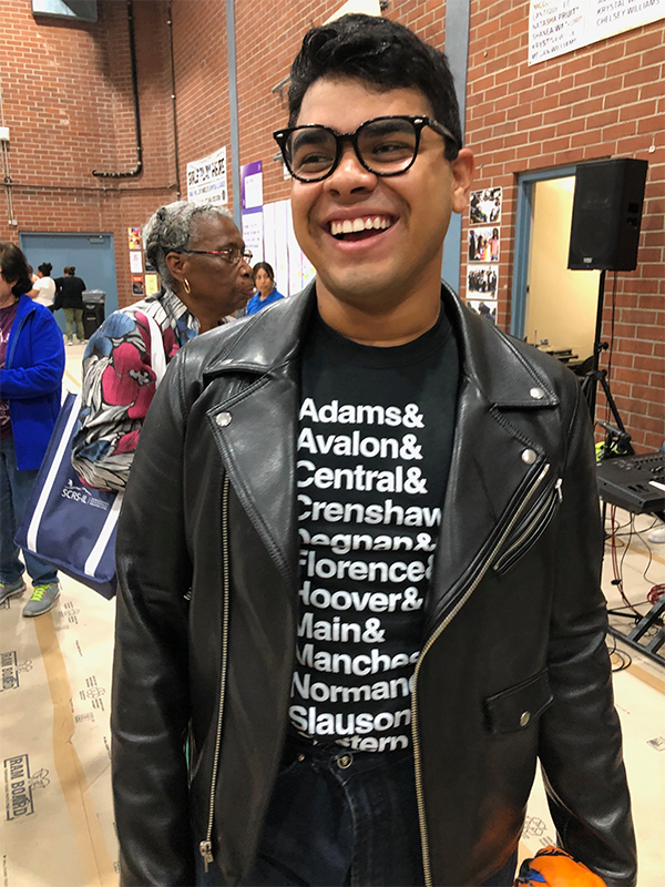 Header Image - Evolving Visual Communications - Post - November2020 Community Outreach Participant with LA Vision Zero Designed T-Shirt On
