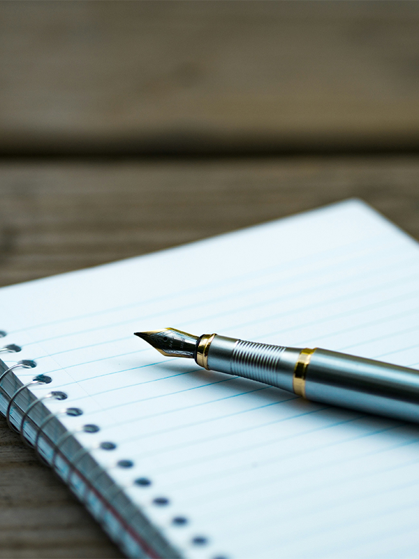 Header Image - Staff Certifications 2021 - Post - December2021 Notebook with pen