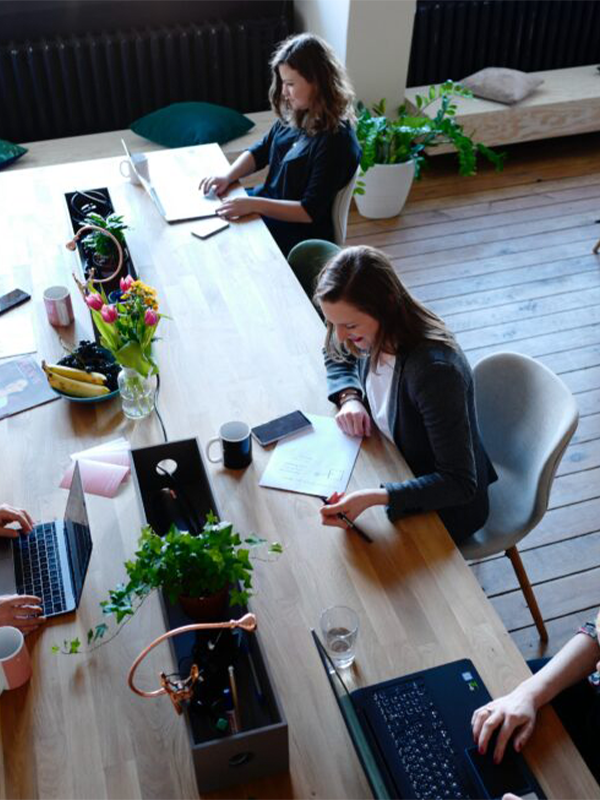 Header Image - Staff Certifications 2022 - Post - December2022 A woman sitting at a desk