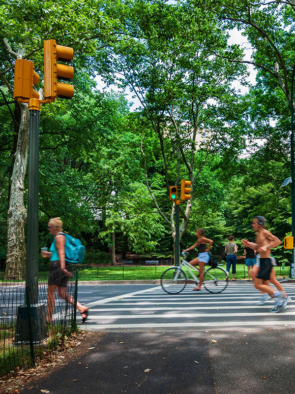 Safer Today Header - post - May2021 people running, biking and walking through intersection with a crosswalk