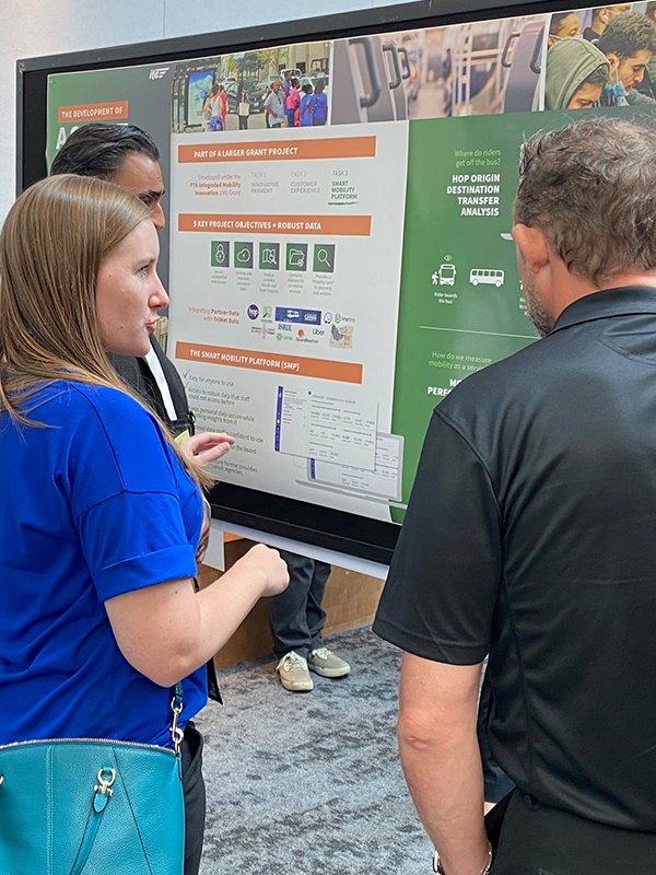 WesternITE 2025 Header - post - June2025 Conference attendees talking at the Fehr & Peers booth at a conference