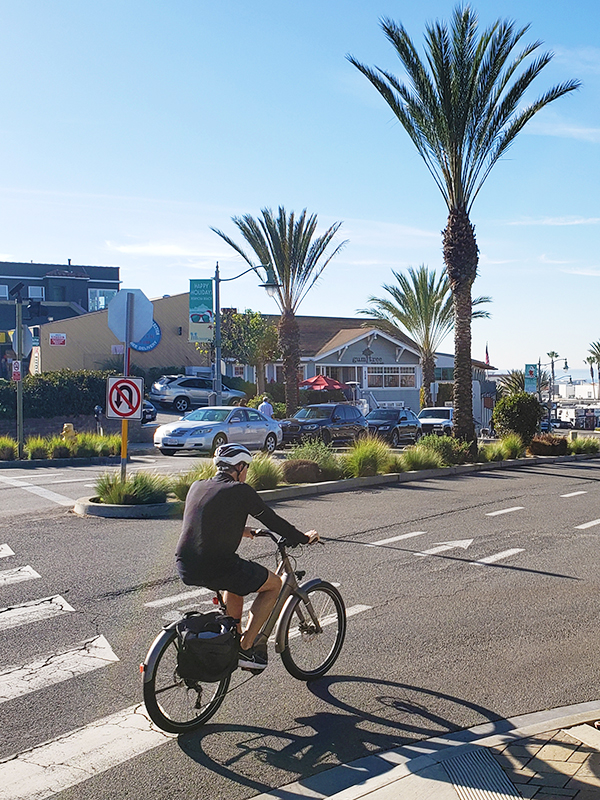Man bicycling along Pier Avenue in Hermosa Beach