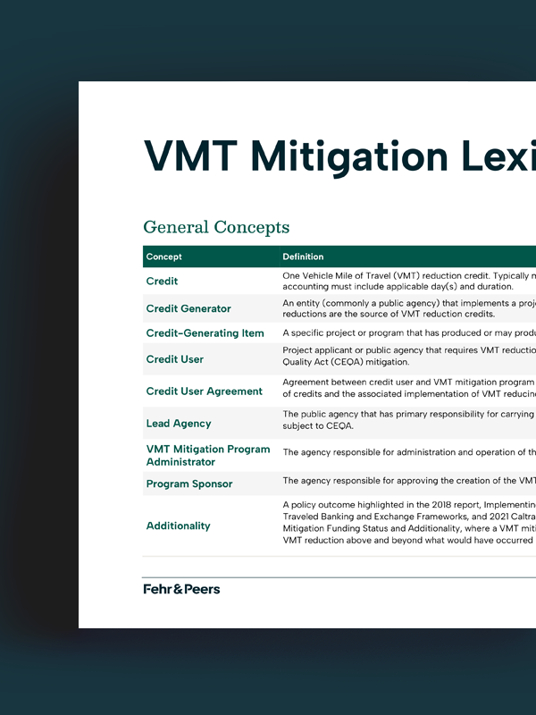 Woman lifting bicycle into a train as she boards