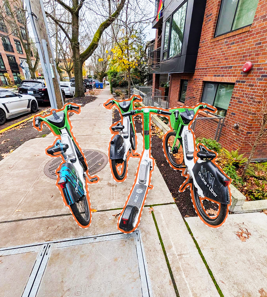 Misplaced e-bikes and scooters in the middle of a walkway.