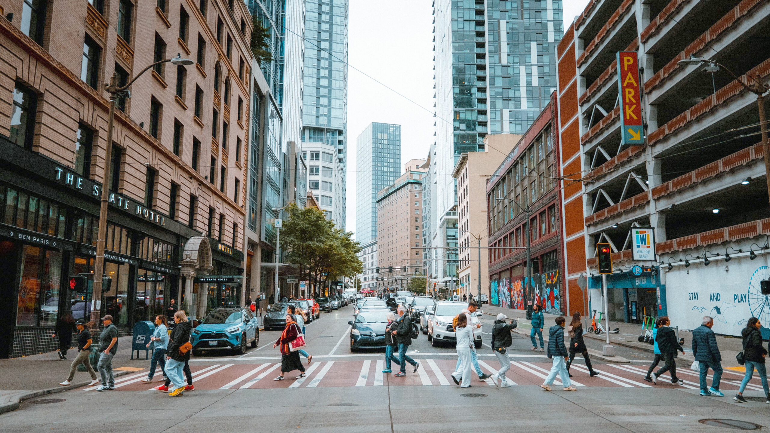 Crowded intersection street crossing - blog - August2026 Crowded street crossing in a nondescript US city.